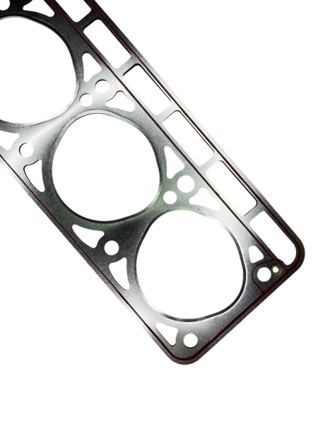 Прокладка головки блока 24 (3-угольные отверстия) усилена (обложена) металлом под Г-БЦМ