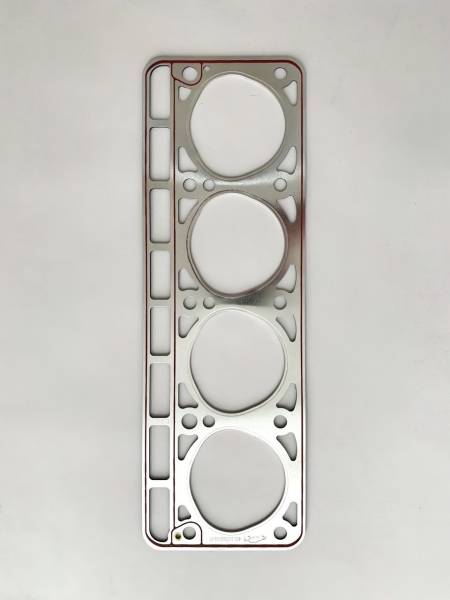 Прокладка головки блока 24 (3-угольные отверстия) усилена (обложена) металлом под Г-БЦМ